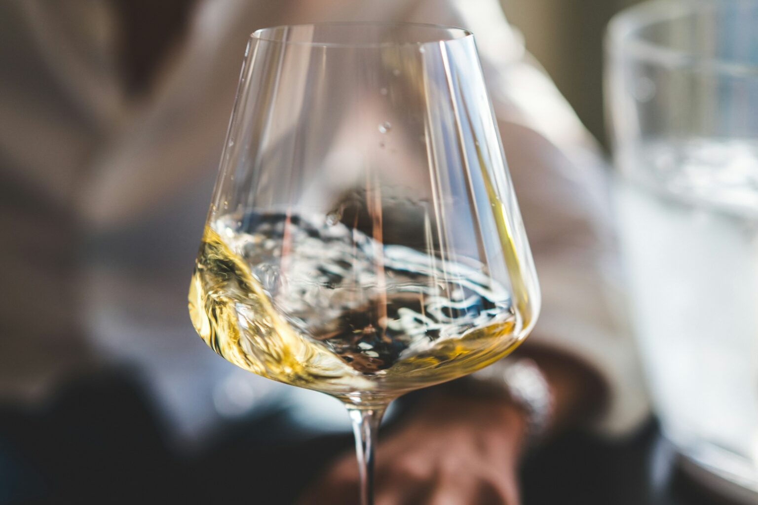 The Most Misunderstood Wine In France: Jura’s Vin Jaune And The Veil A glass of golden Jura vin jaune, the deep amber color reflecting the years aged in cask under the voile yeast veil that defines the Jura's vin jaune tradition.