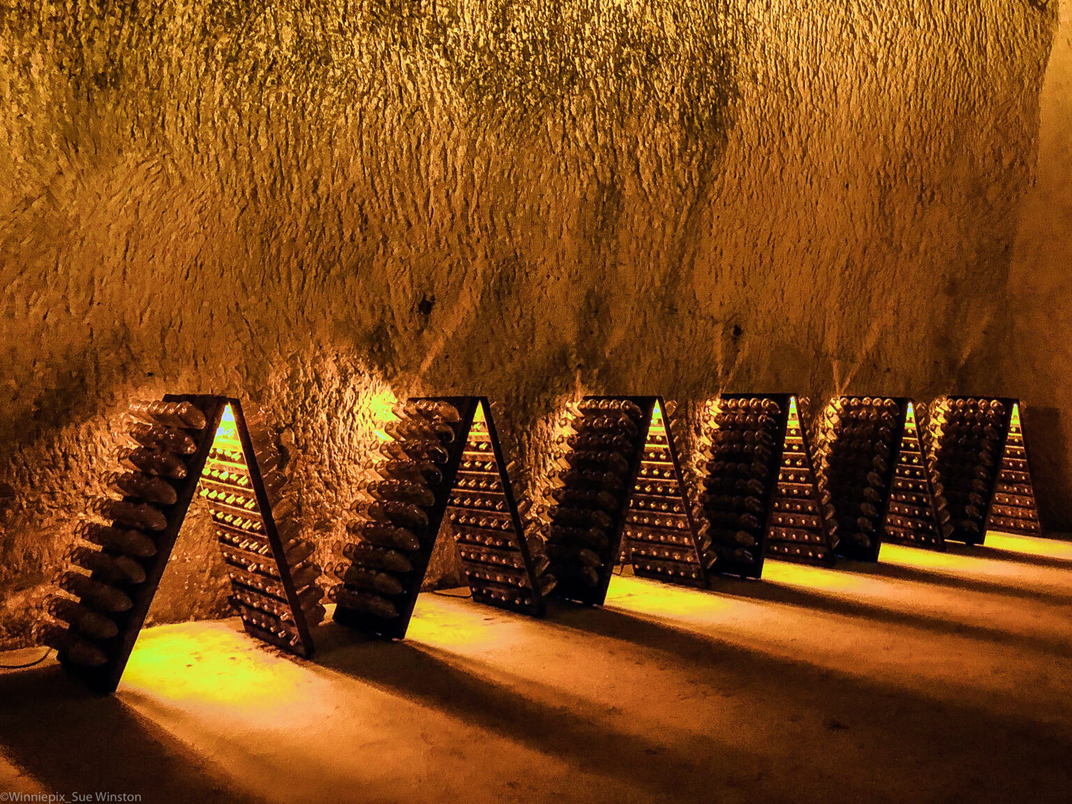 Champagne’s Single-Vineyard Turn: The Lieux-Dits Movement After Selosse Riddling racks of single-vineyard Champagne aging in a chalk cellar in Reims, where the lieux-dits movement bottles each parcel under its own name.